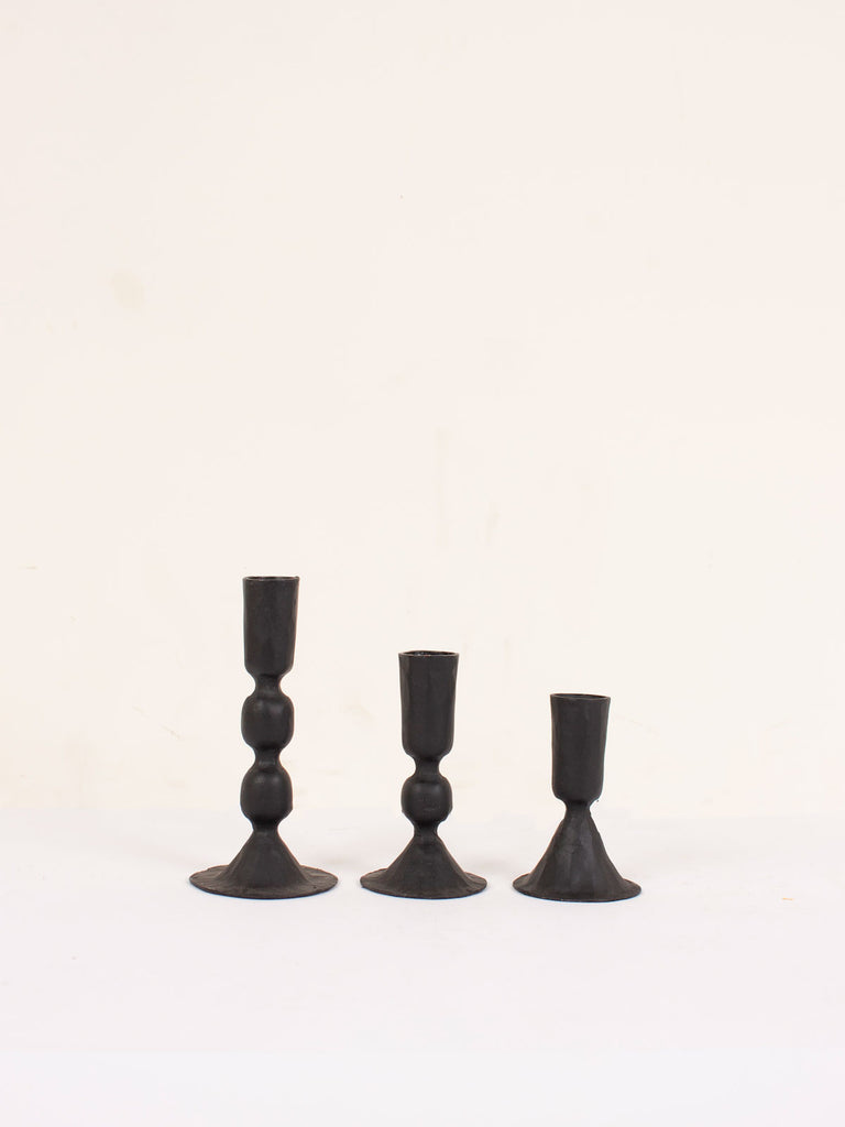 The 3 sizes of black metal Austen candleholder in a row