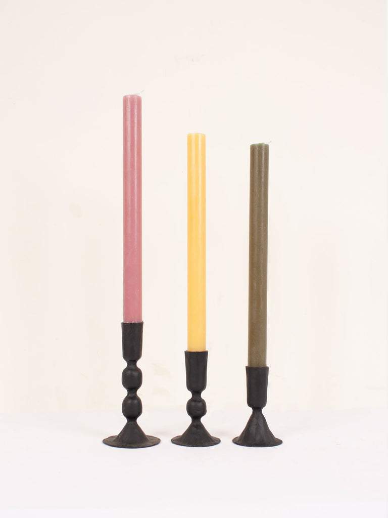 3 different sizes of black metal Austen candleholders with colourful candles