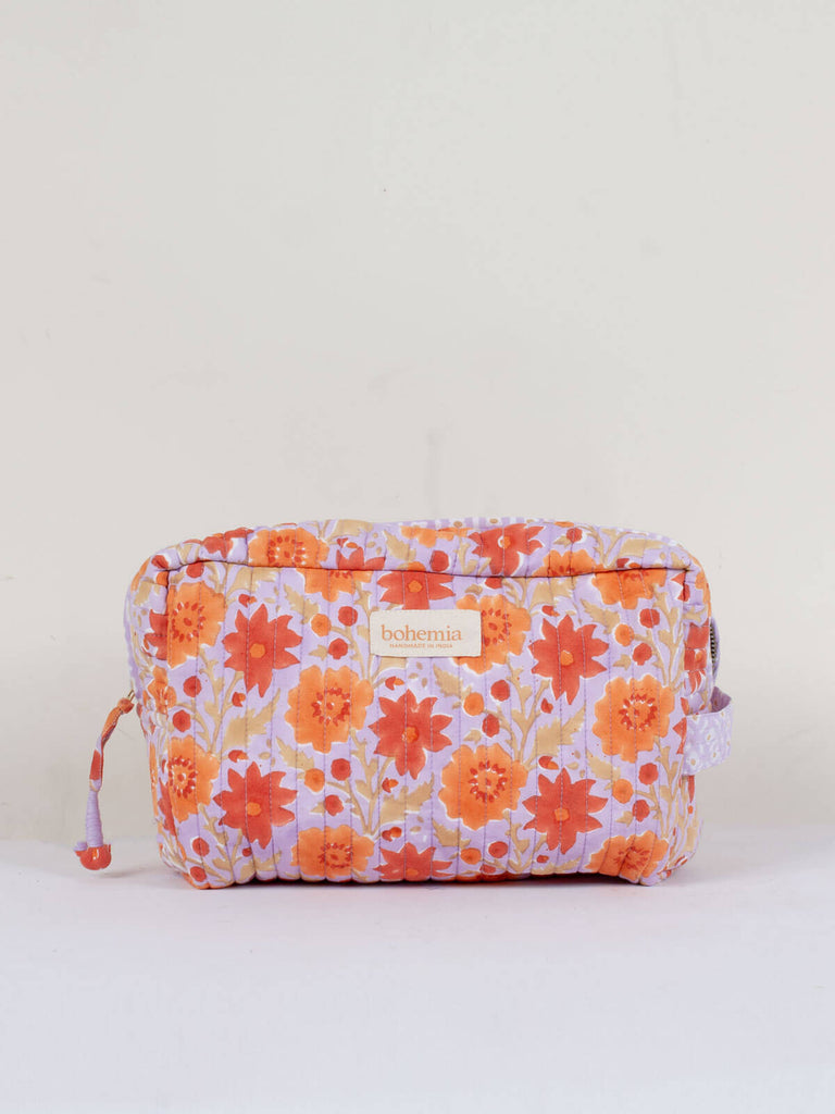 Botanical inspired Floribunda hand block print, cotton quilted wash bag in lilac and orange