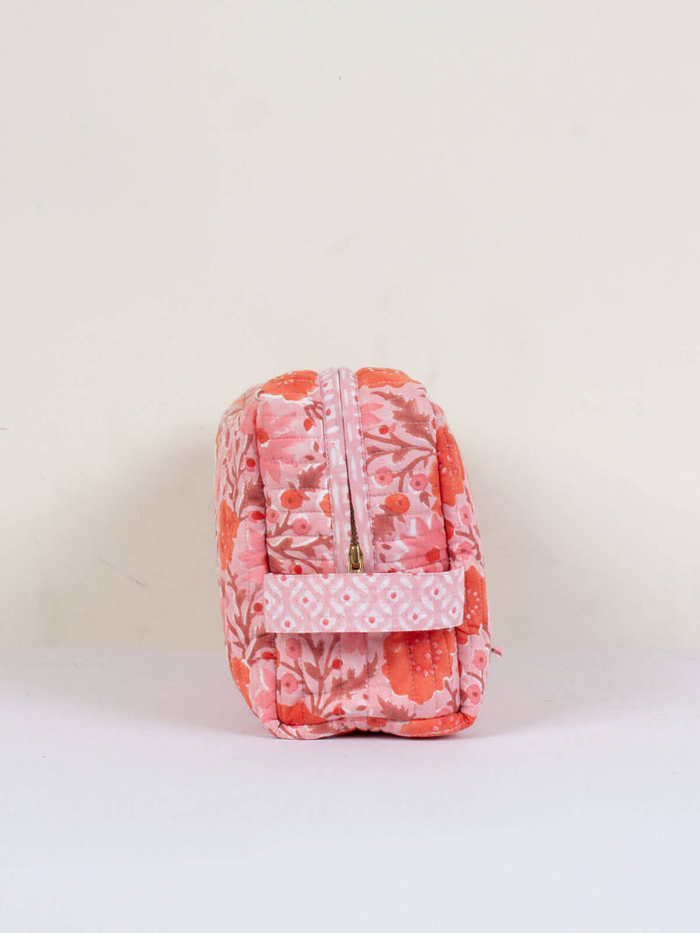 The large Floribunda quilted wash bag in vintage pink with useful carry handle.