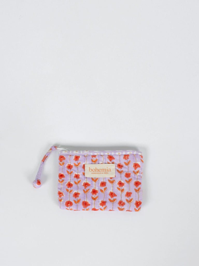 Small quilted cotton zip pouch hand block printed in Jaipur, with a lilac and orange ditsy floral print 