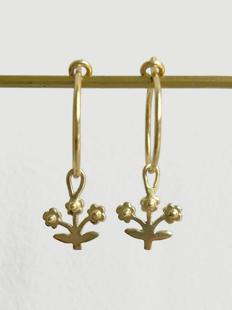 Close up of the gold plated posie hoop earrings from Bloom, a modern bohemian jewellery collection by Bohemia
