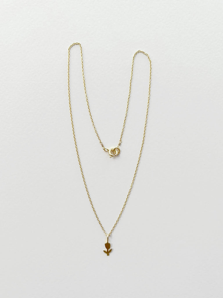 Gold tulip necklace on a fine gold chain with minimalist clasp