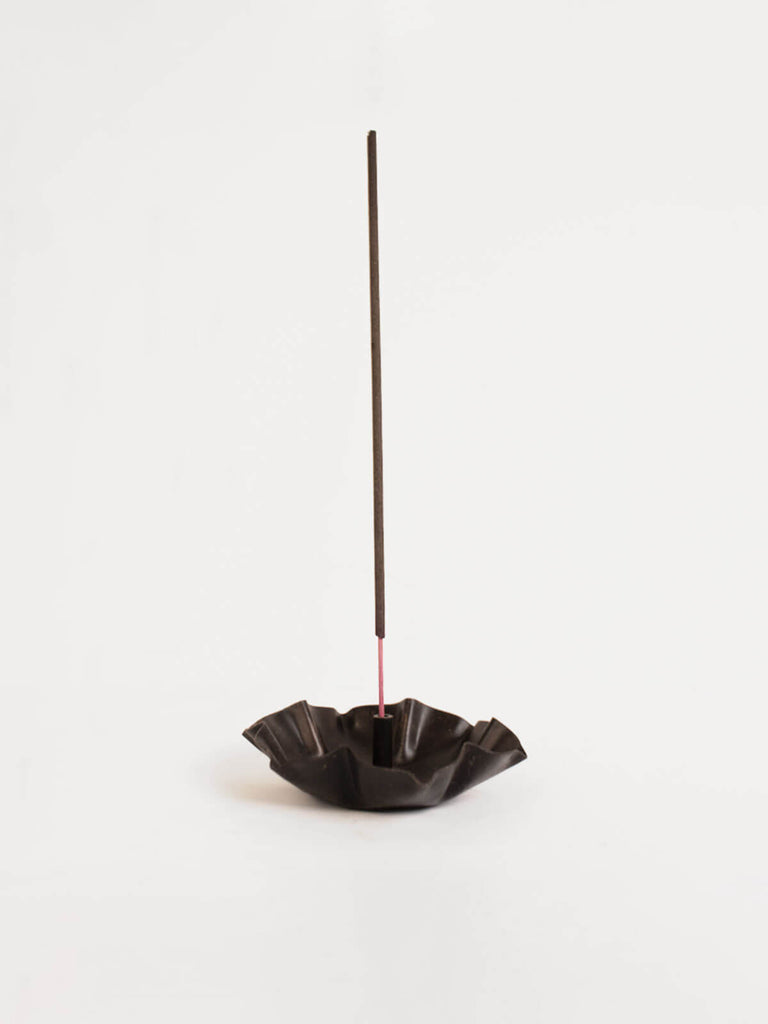 Antiqued iron incense holder in a lotus flower shape