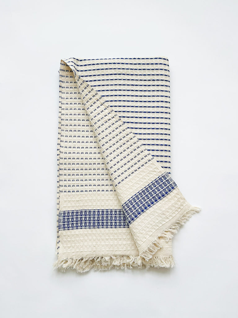 Turkish cotton hammam towel with soft waffle textured weave, revealing a blue striped pattern on both sides | Bohemia Design