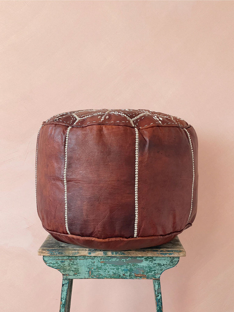 Chestnut brown Moroccan leather pouffe with white embroidered panels
