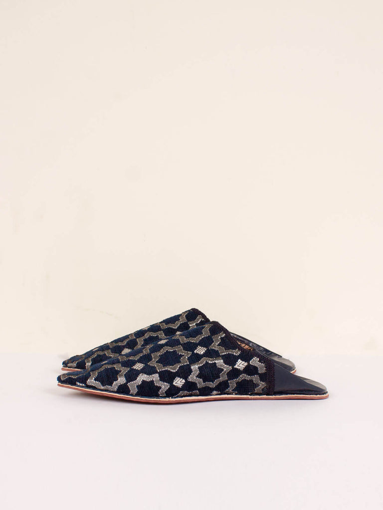Side view of a pair of Moroccan Star Brocade Pointed Babouche Slippers in Indigo