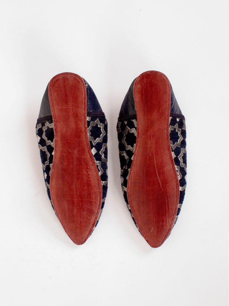 Image showing the hard leather soles of a pair of Moroccan Star Brocade Pointed Babouche Slippers in Indigo