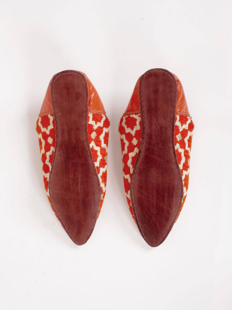 Hard leather sole of a pair of Moroccan Star Brocade Pointed Babouche Slippers in Orang