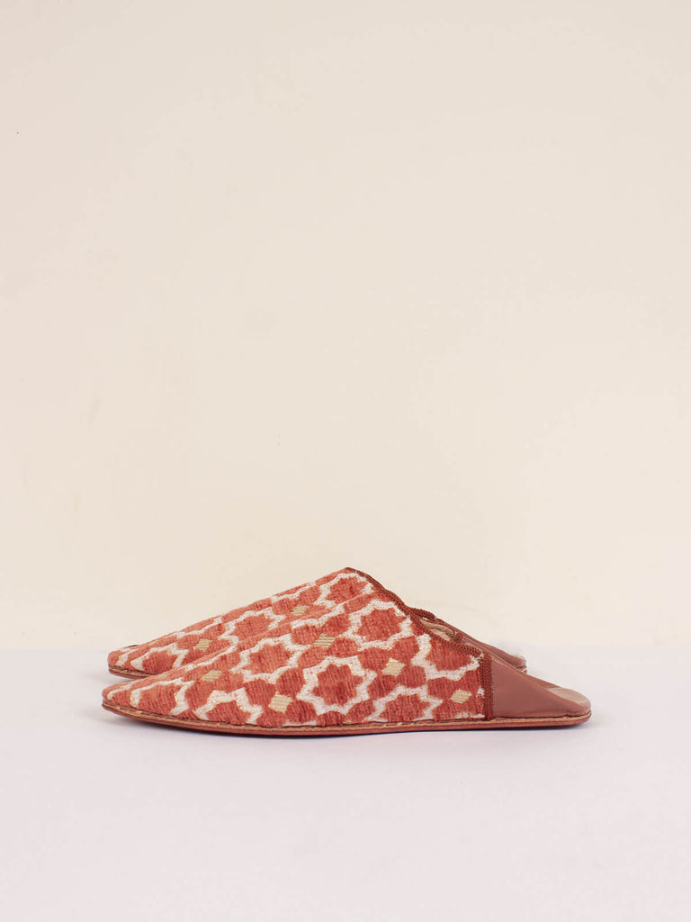 Side view of a pair of Moroccan Star Brocade Pointed Babouche Slippers, Terracotta