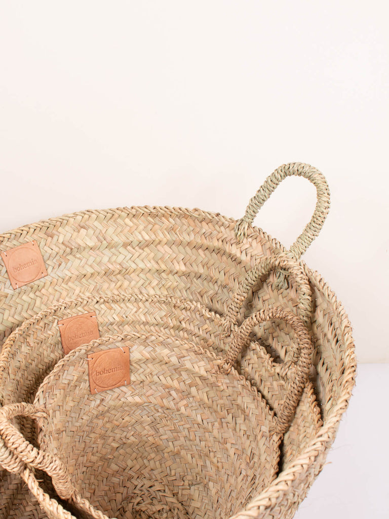 Three versatile sizes of natural woven Beldi storage baskets by Bohemia Design