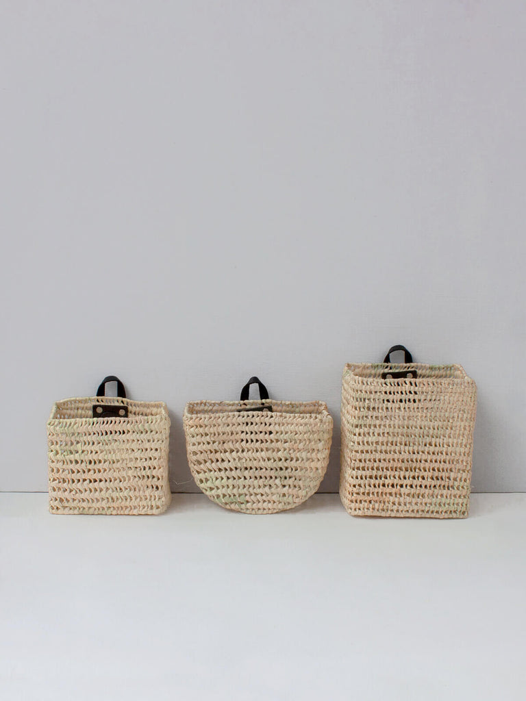 Set of 3 versatile mini wall hanging storage baskets. Hand woven from natural palm leaf