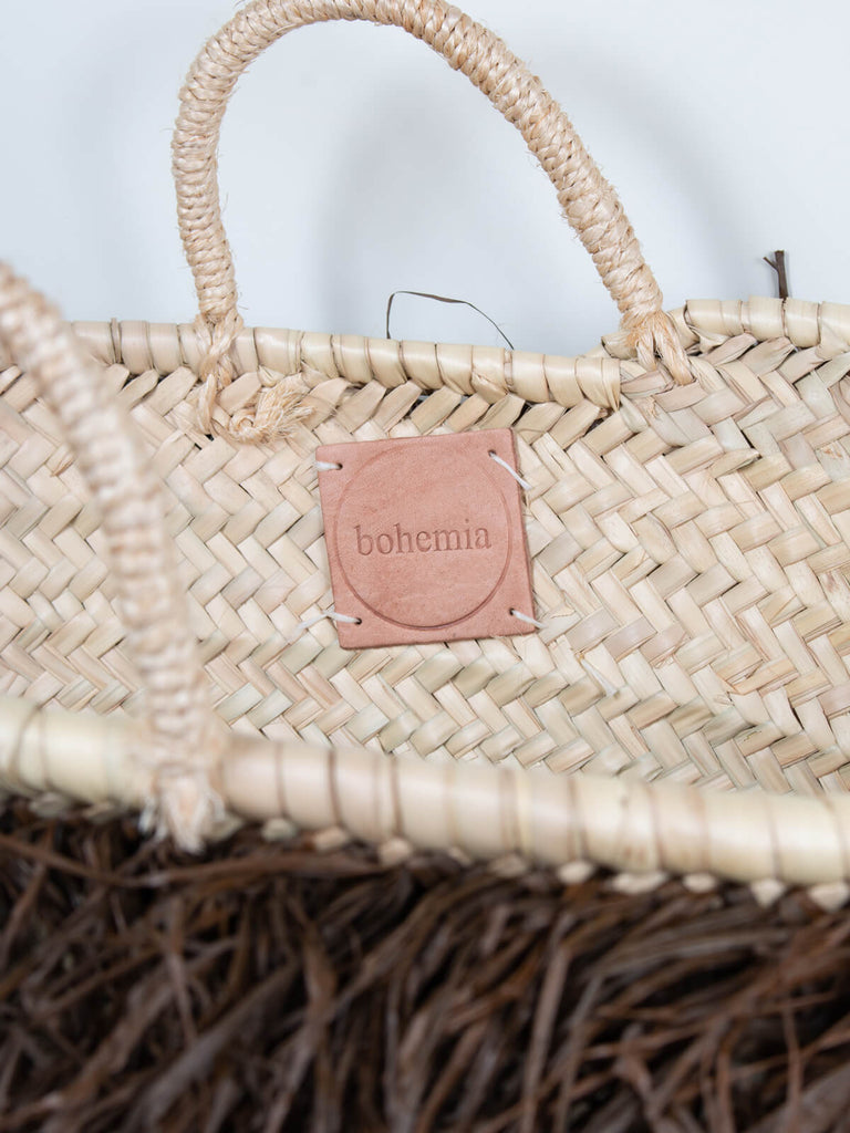 Close up of the Bohemia branded leather label and short handles