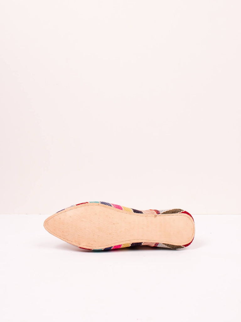 Underside of Bohemia design boujad babouche slippers in multi stripe pattern
