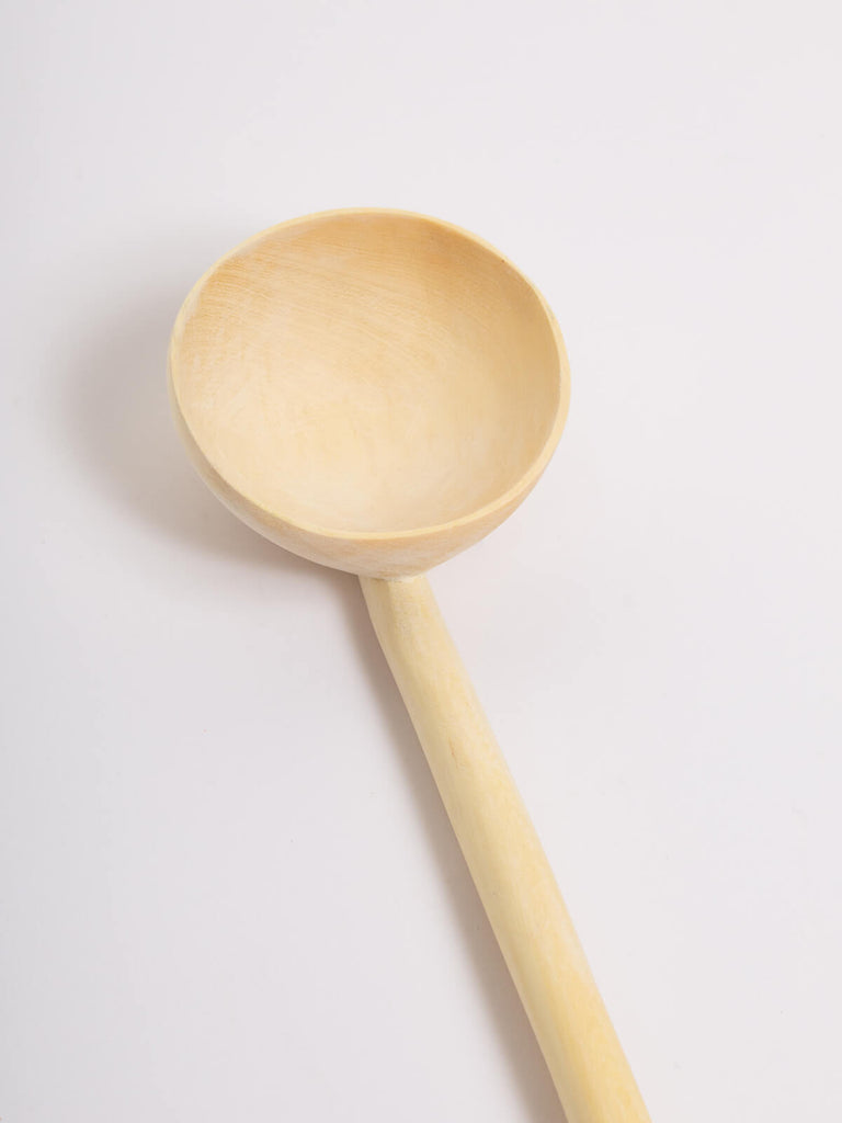 Close up of a large lemon wood spoon by Bohemia Design