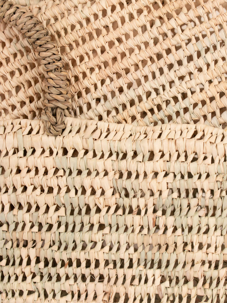 Close up of the palm leaf open weave design on the baskets