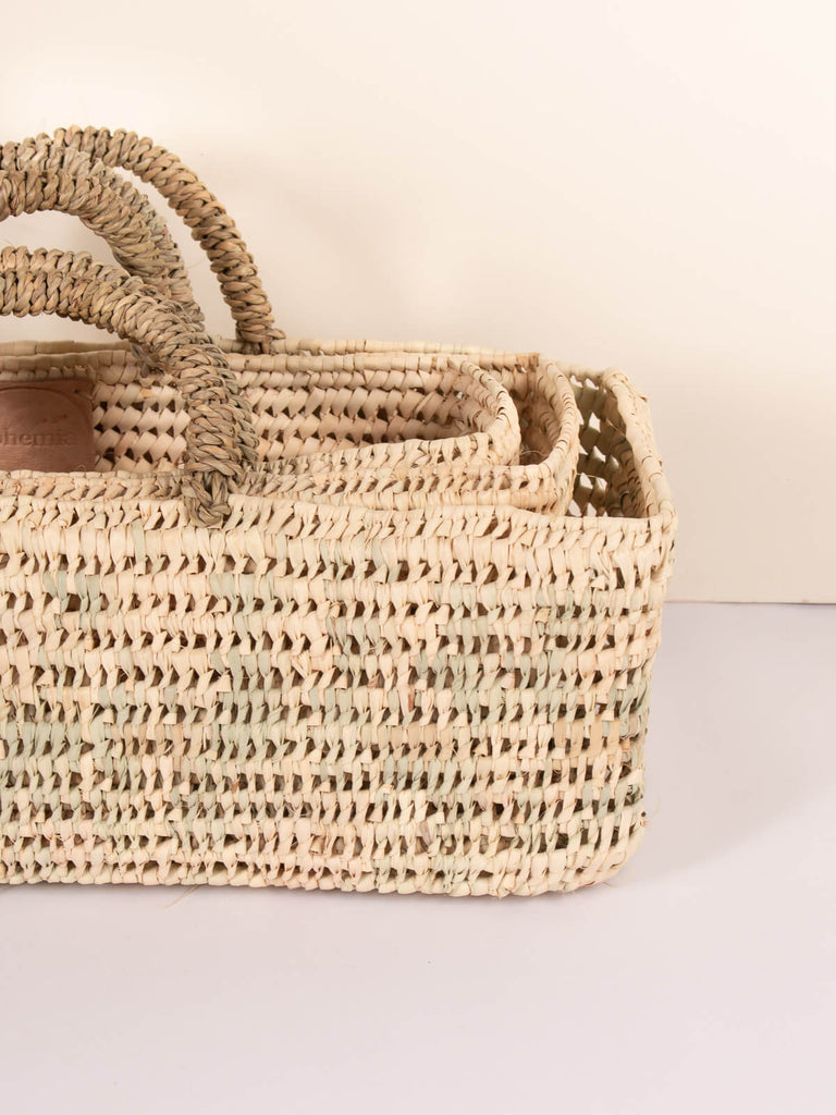 Set of three different sized long open weave storage baskets by Bohemia Design