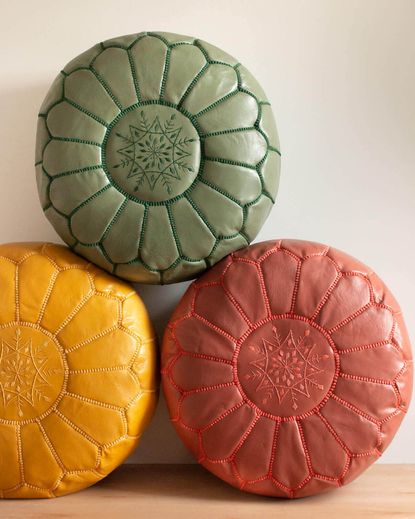 A trio of Moroccan Leather Pouffes including Olive green by Bohemia Design