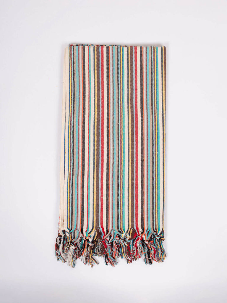Rainbow hammam towel with cool retro stripes and a hand tied tassel trim