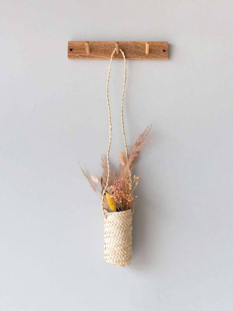 Medium Slim Hanging Basket on a wooden hook filled with dried flowers