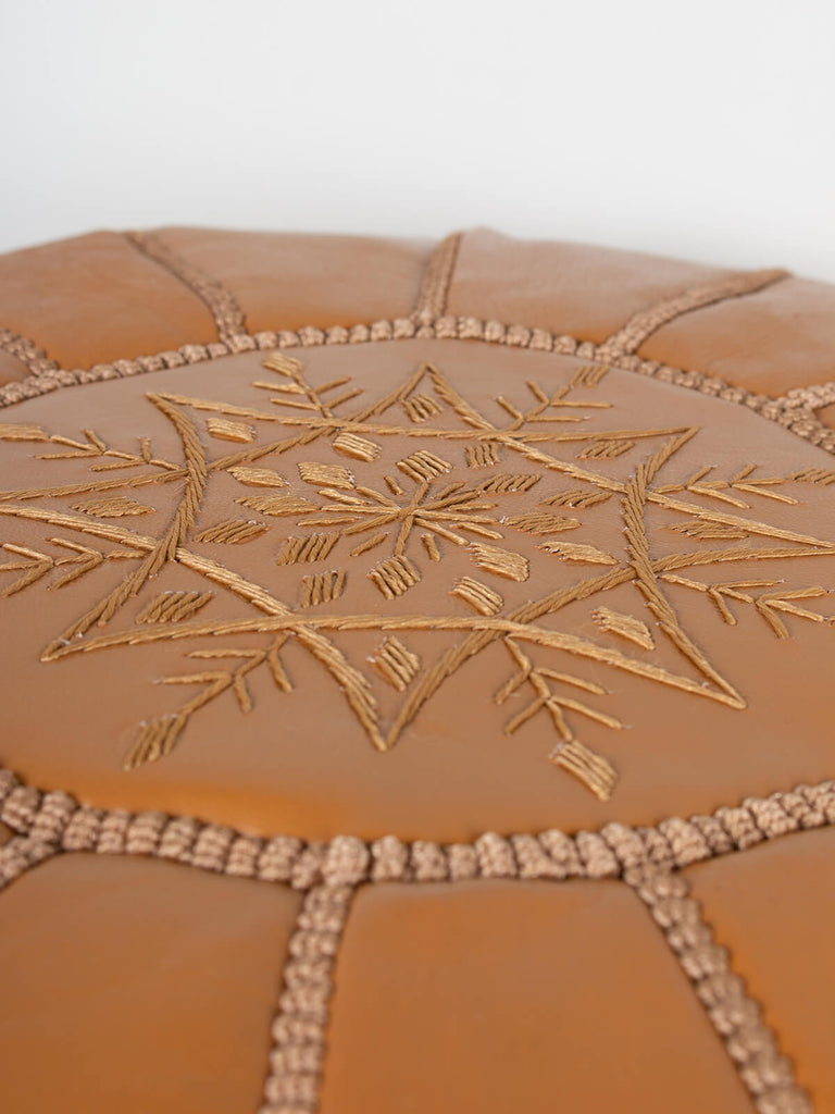 Moroccan leather pouffe in an ochre colour with hand-stitched details by Bohemia Design