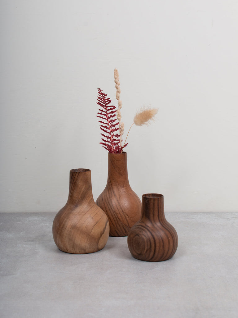 Group of three mini wood vases with dried flowers