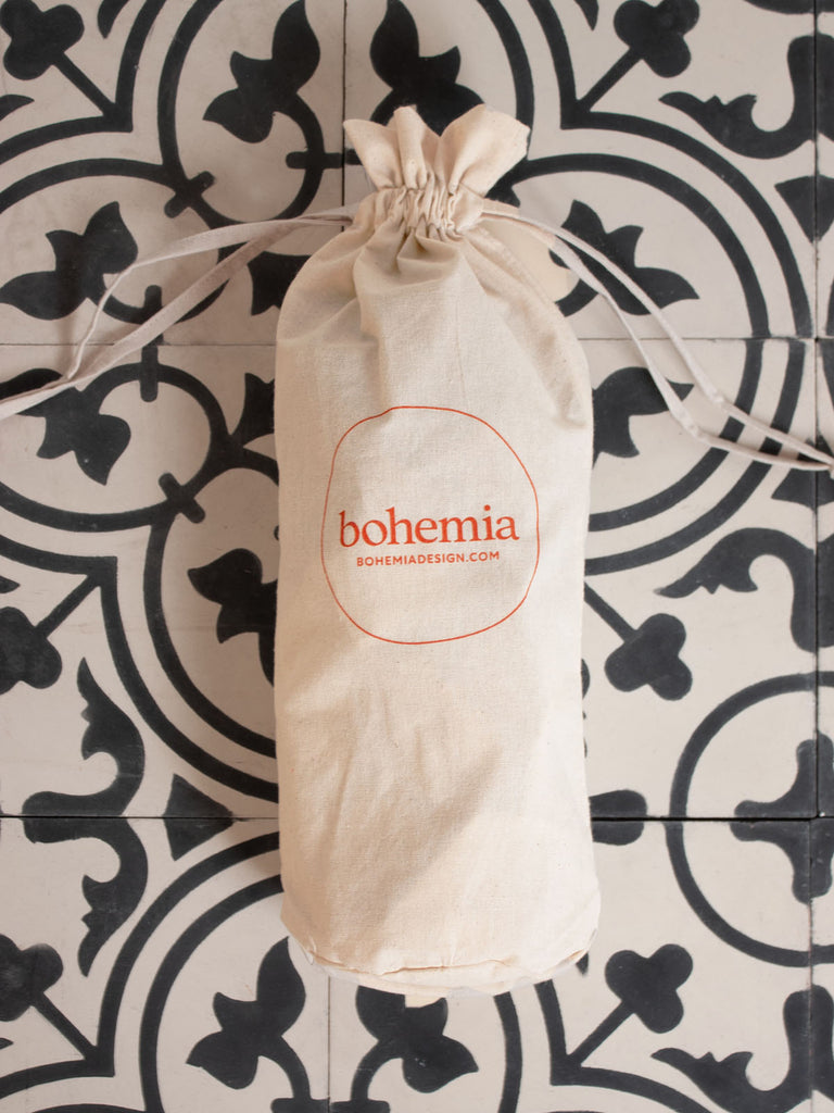 Natural cotton drawstring dustbag with Bohemia logo in terracotta