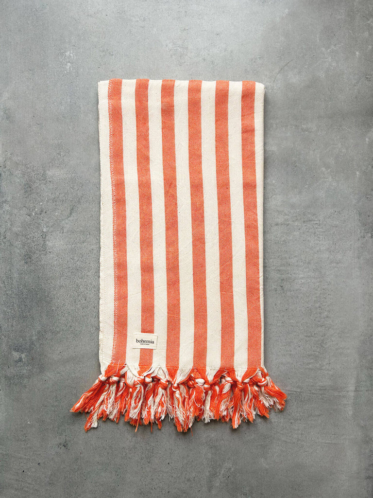 Brighton Stripe cotton hammam towel with bold orange summer stripe and finished with fringe | Bohemia Design