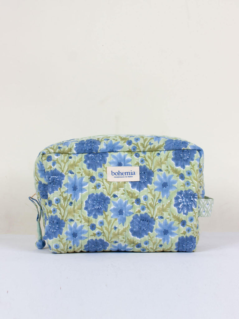 Large hand block print, cotton quilted wash bags with a soft sage green and blue floral design