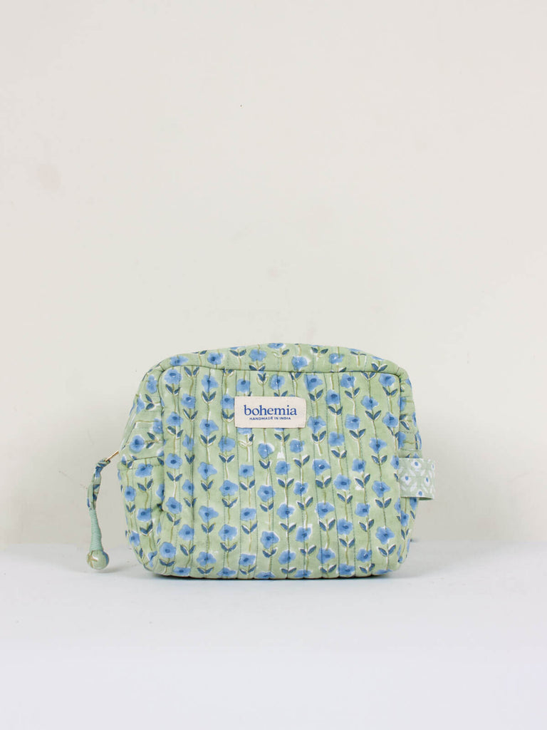 Small hand block print, cotton quilted wash bags with a soft sage green and blue ditsy floral design