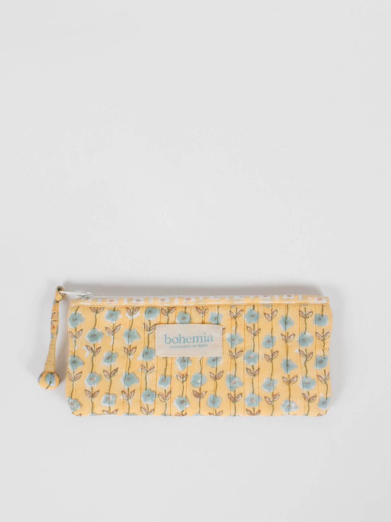 Long quilted cotton zip pouch hand block printed in Jaipur, fully lined with a buttermilk yellow ditsy print