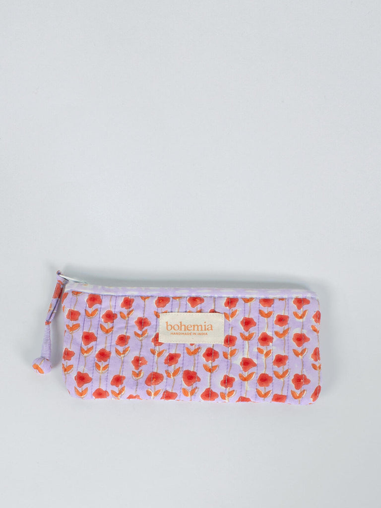 Long quilted cotton zip pouch hand block printed in Jaipur, fully lined with a lilac and orange ditsy prin