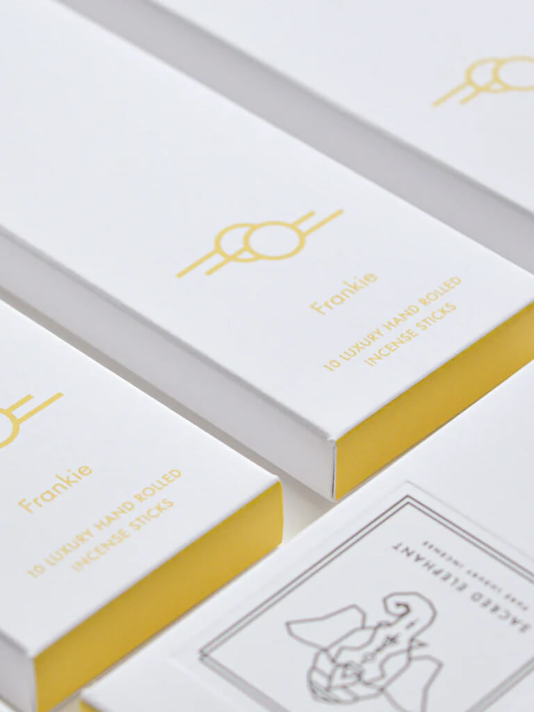 White and yellow boxes of Sacred Elephant Frankie incense