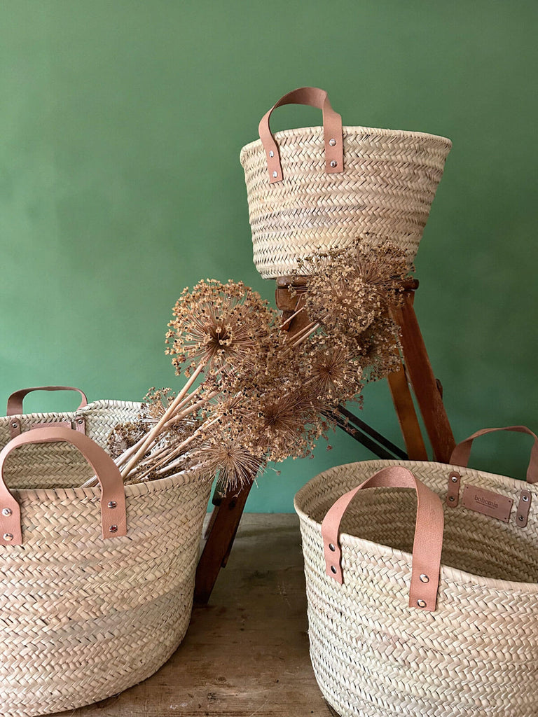 Natural woven storage baskets with leather handles, set of three