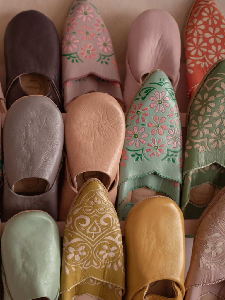 A display of different styles of Bohemia Moroccan slippers including basic babouche slippers in ballet pink