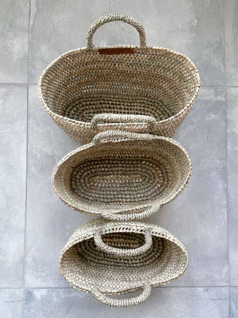 Small, medium and large woven storage or shopping nesting baskets with open weave pattern