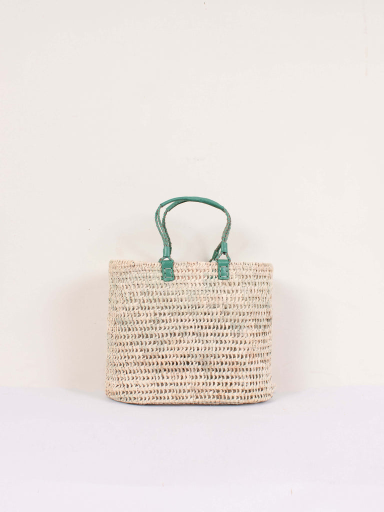 Small open weave basket with sage coloured pleated leather handles