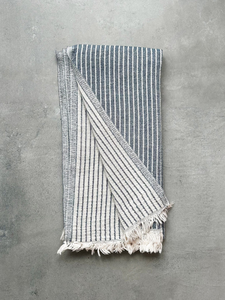 Portobello Hammam Towel in indigo blue, revealing a soft textured striped pattern on both sides | Bohemia Design