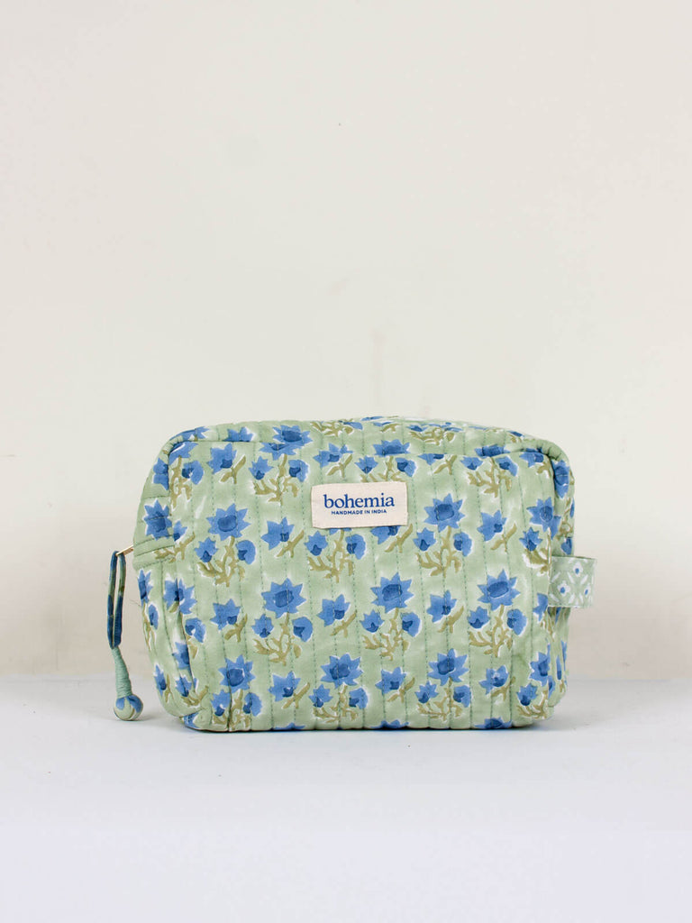 Medium hand block print, cotton quilted wash bags with a soft sage green and blue floral design