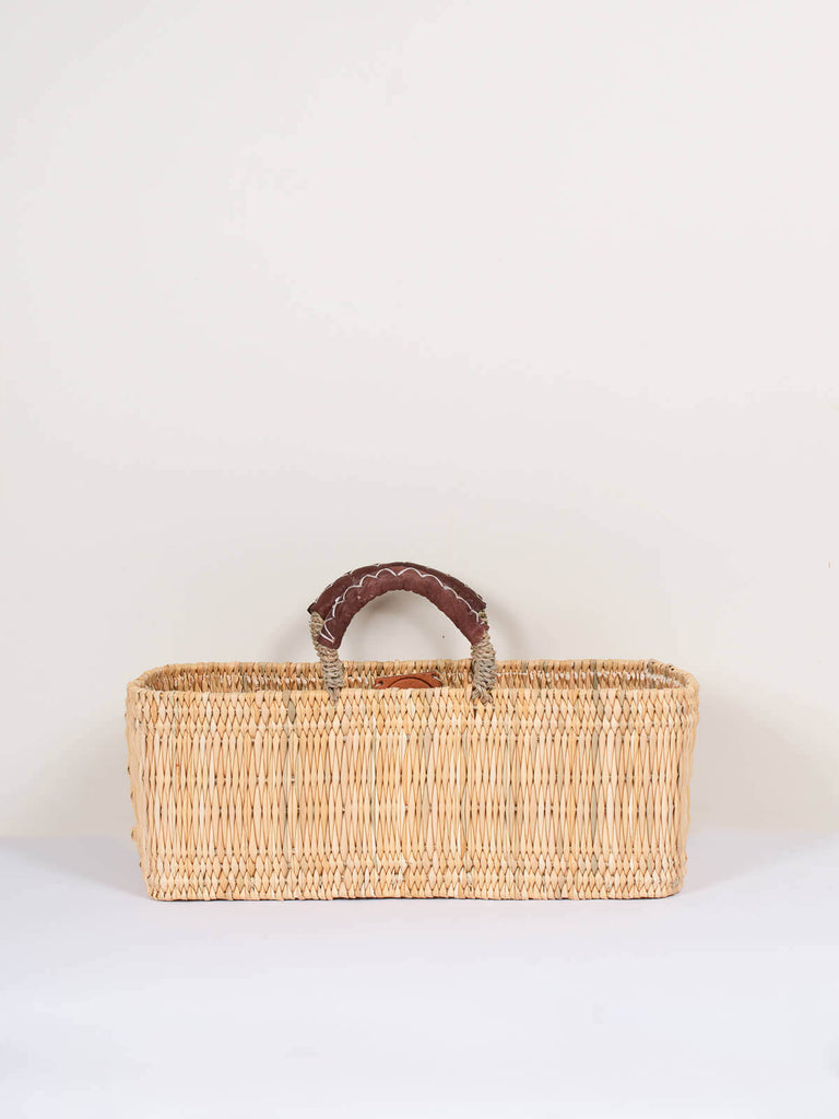 Large natural woven Moroccan reed storage basket bag with leather handles