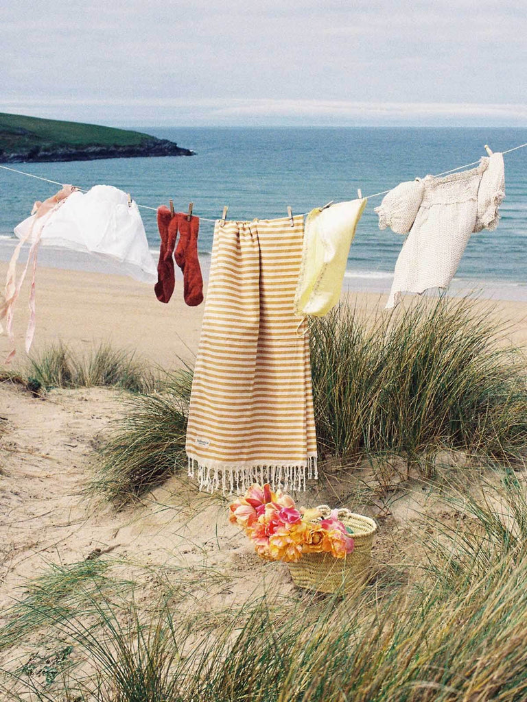 Classic stripe Sorrento cotton hammam towel on a washing line on the beach