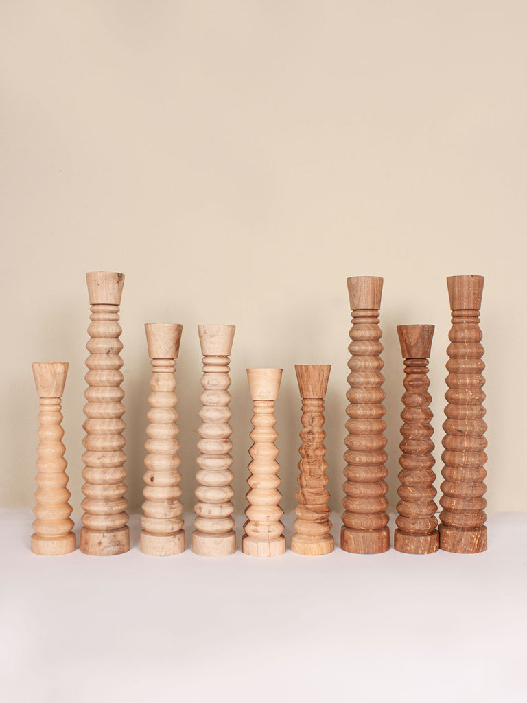 Group of Walnut Wood Candle Holders sculpted in a pleasing ripple form