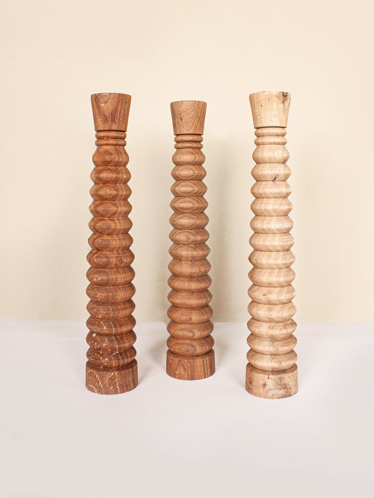 Group of 3 walnut wood ripple candle holders showing the difference in colour and grain texture