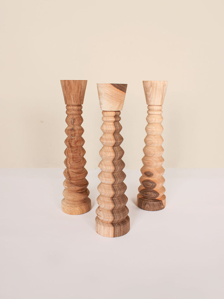 Group of 3 small ripple candle holders showing the characterful walnut wood grain patterns