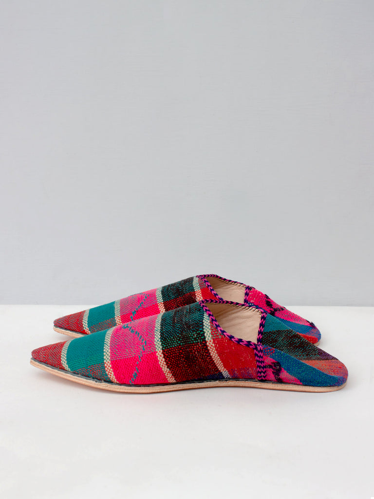 Side view of a pair of handmade leather and vintage fabric Moroccan Boujad Pointed Babouche Slippers by Bohemia Design