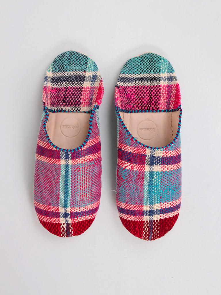 A pair of limited edition Moroccan Boujad Fabric Basic Babouche Slippers, Essaouira Check in pink and blue plaid by Bohemia Design