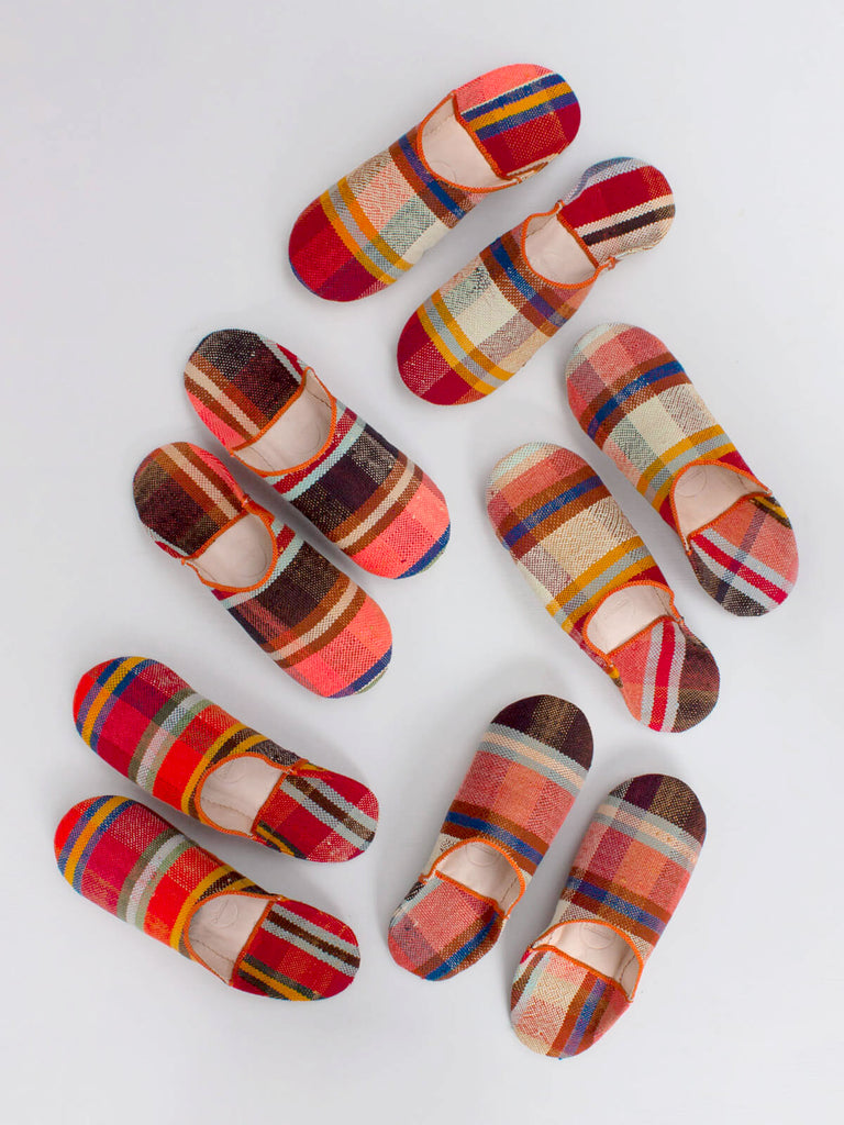 A group of Moroccan Boujad Fabric Basic Babouche Slippers, Sunset Check by Bohemia Design