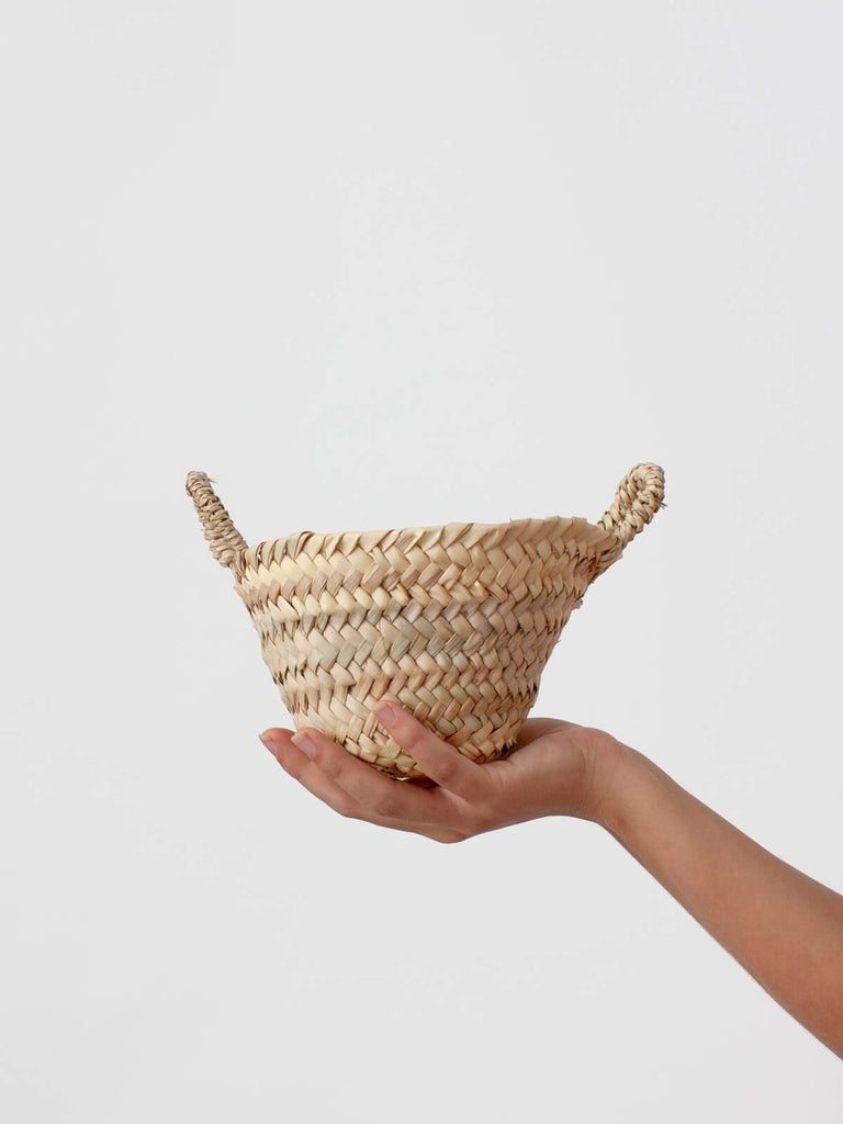 Mini beldi basket by bohemia design held by a woman's hand