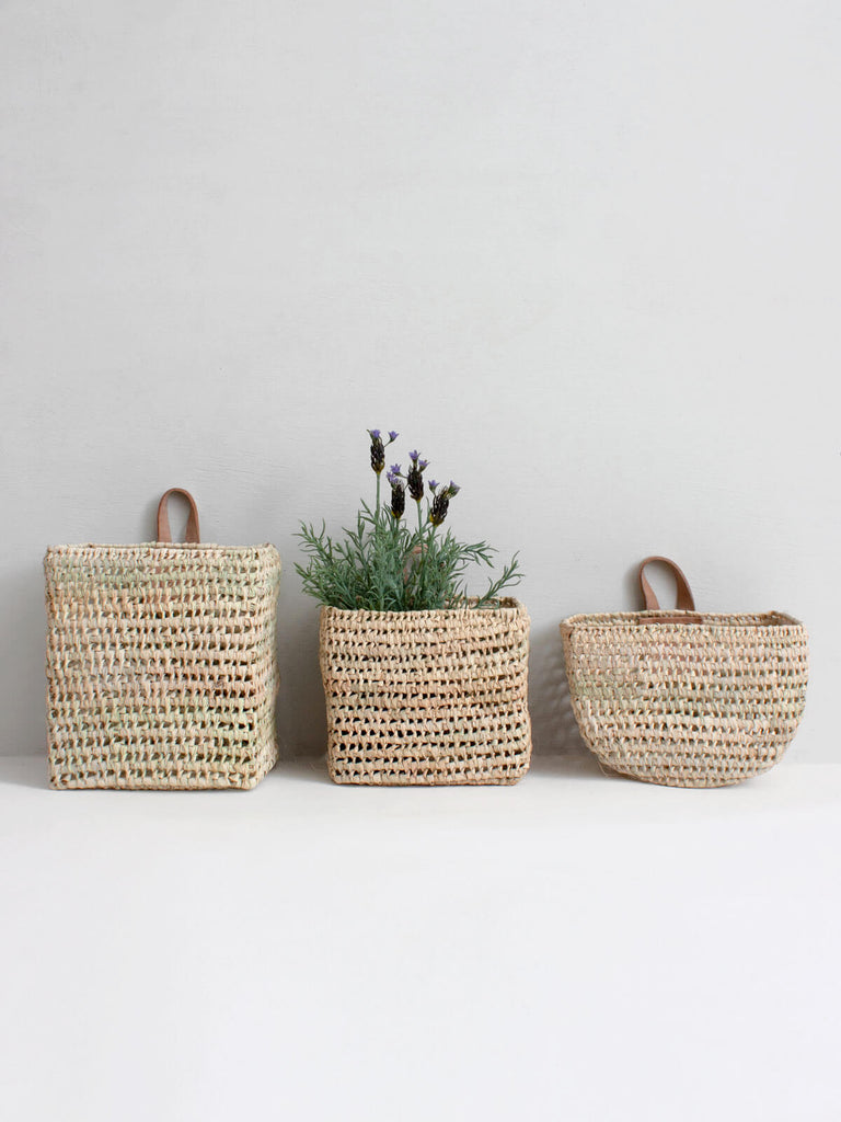 Set of 3 mini wall hanging storage baskets in contemporary shapes and open weave design.