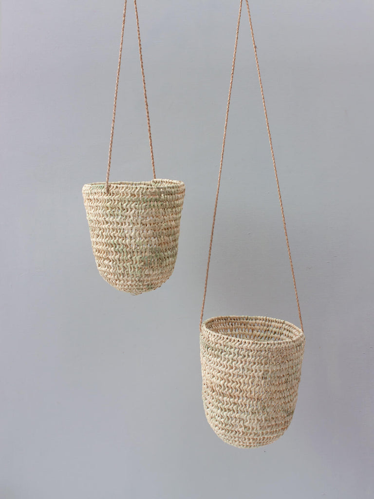 Natural open weave hand woven indoor hanging planter baskets with elegant leather braided thongs